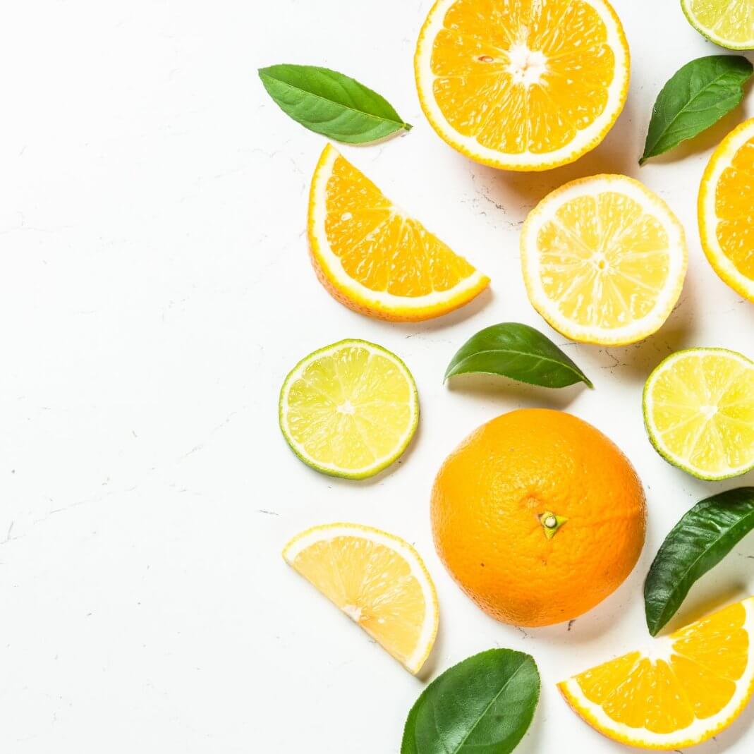 Colorful assortment of citrus fruits with vibrant orange and lemon slices, showcasing freshness and energy.
